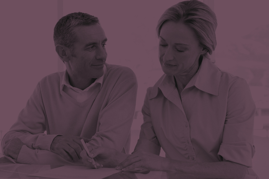 Image of a couple signing documents